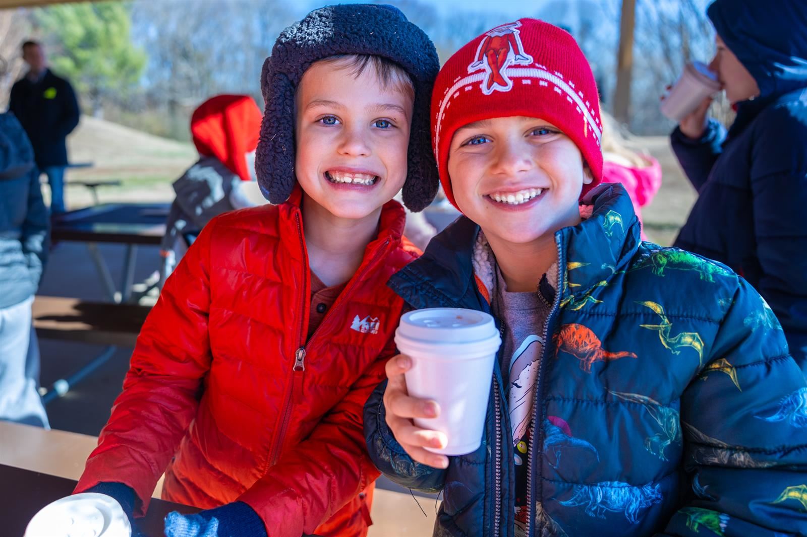 two boys wearing hats